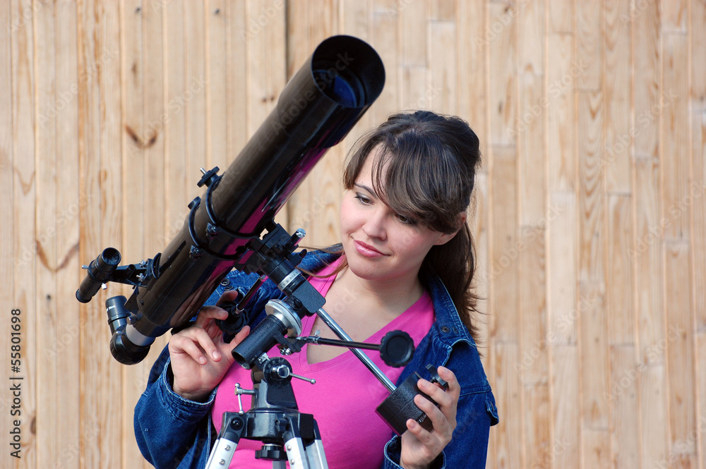 Obraz premium Teen girl and telescope, Near Kiev,Ukraine