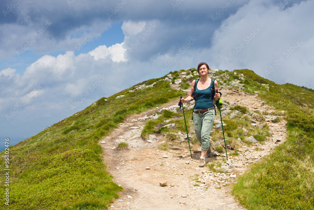  woman hiking in mountains