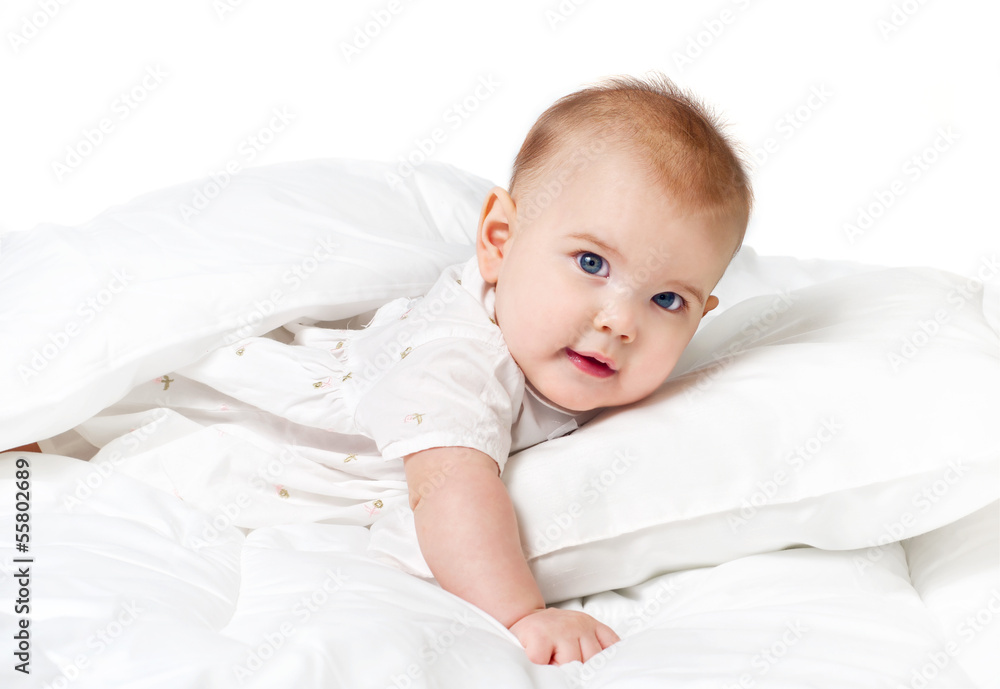 Sweet baby lying on a white pillow Sweet baby lying on a white pillow