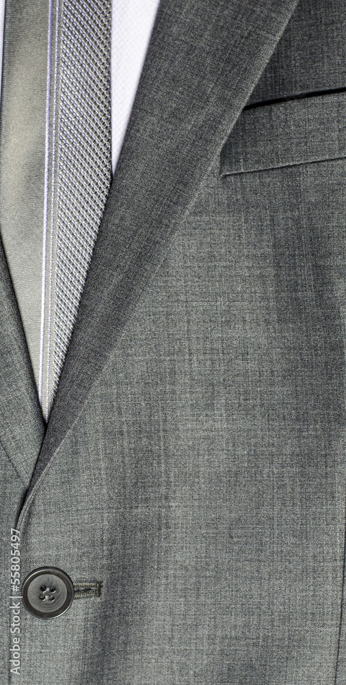 detail of a grey man suit with tie detail of a grey man suit with tie
