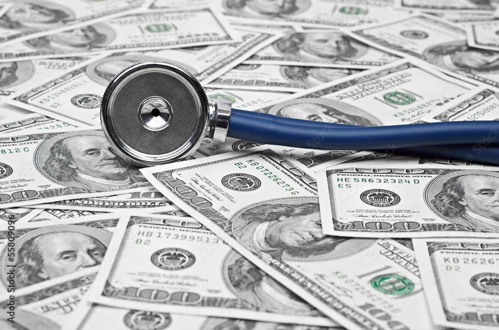 heap of dollars with stethoscope heap of dollars with stethoscope