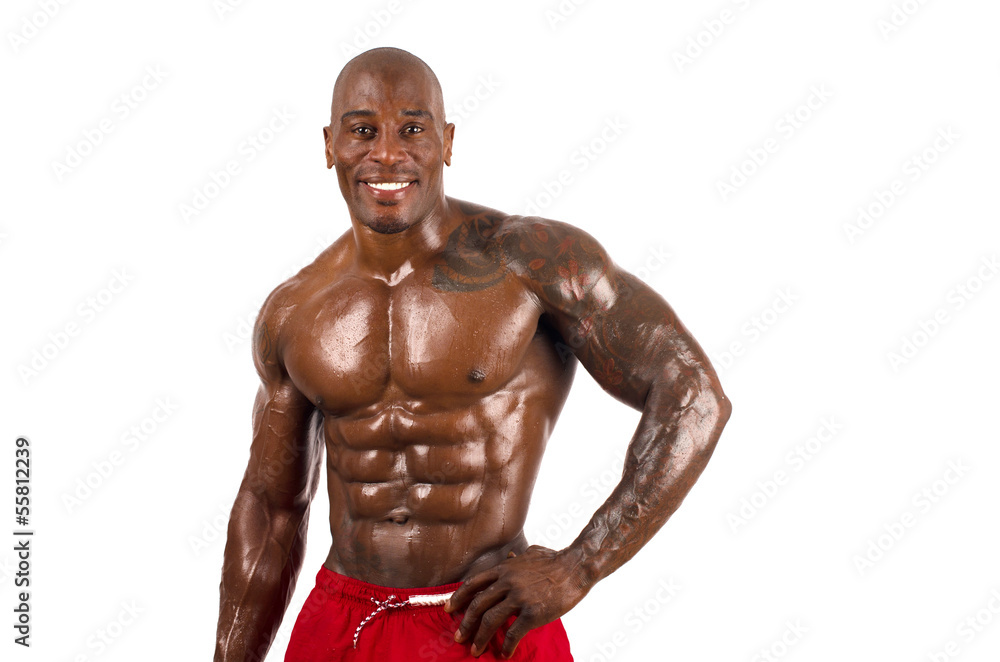 Confident black bodybuilder smiling.Strong man