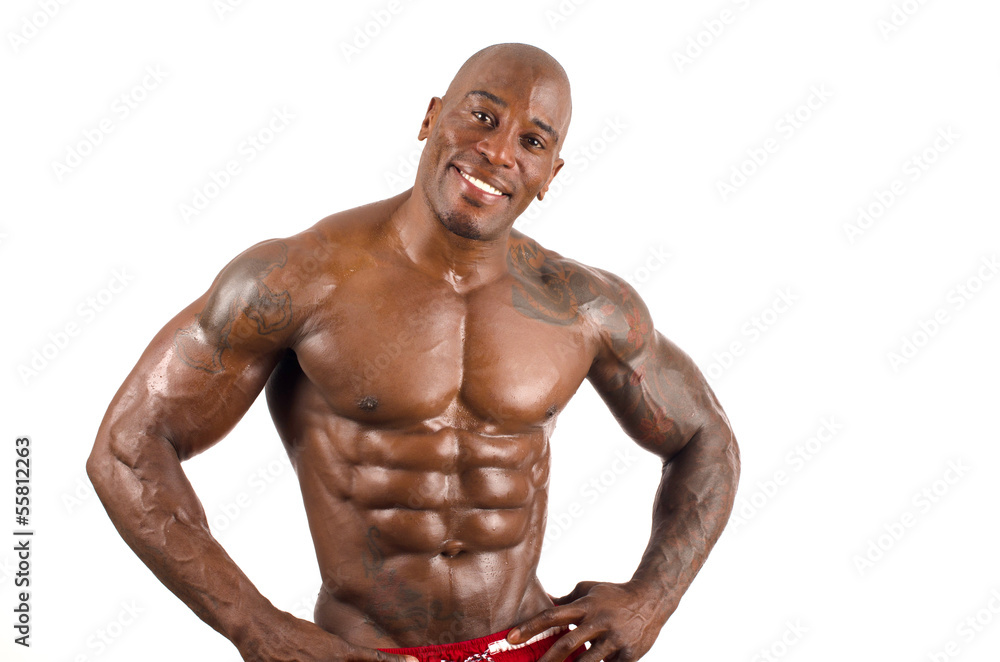 Confident black bodybuilder smiling.Strong man