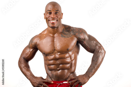Confident black bodybuilder smiling.Strong man