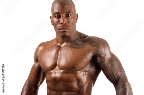 Topless black bodybuilder. Strong man showing perfect muscles