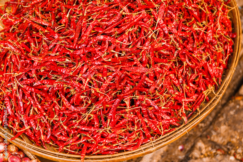 Naklejka premium Preservation procedure of red Chili peppers on basket