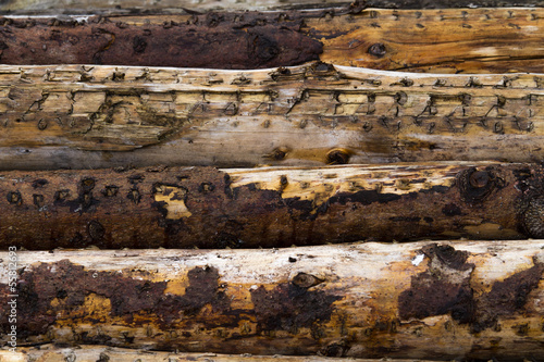 pile of wood poles old textured