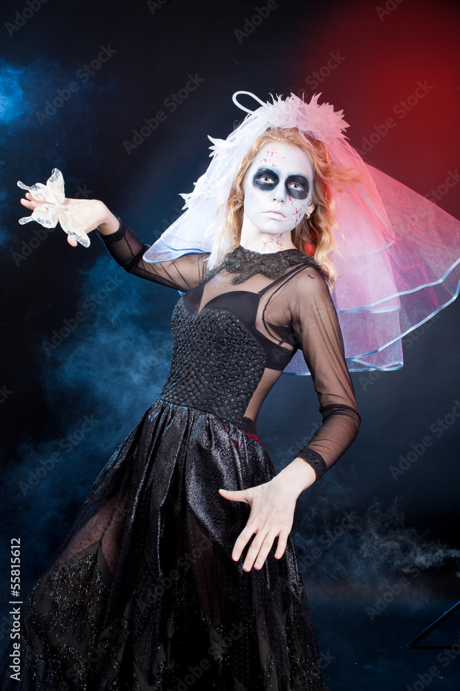 woman  wearing  as  dead or witch. Halloween
