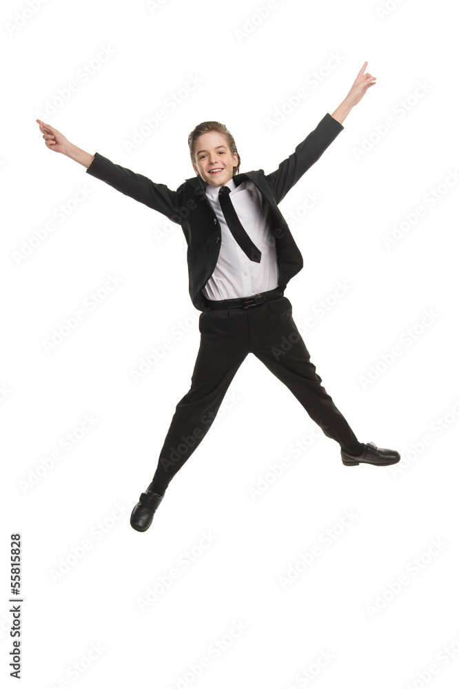 Happy little businessman. Cheerful little boy in formalwear jump