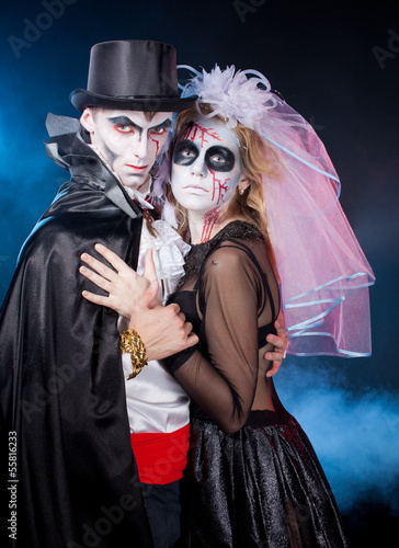 man and woman  wearing  as  vampire and witch. Halloween