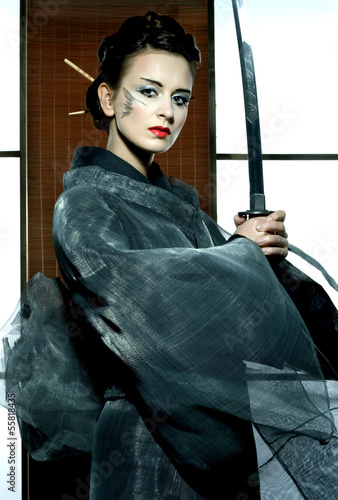 beautiful japanese kimono woman with samurai sword photo