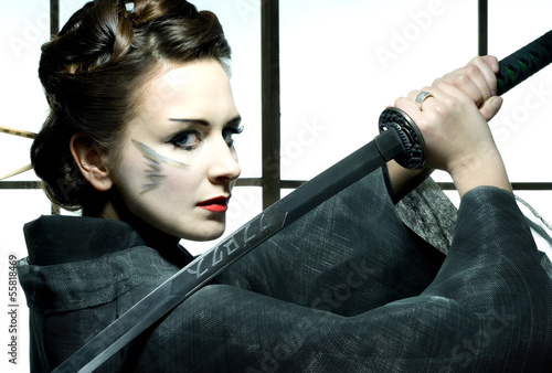 beautiful japanese kimono woman with samurai sword photo