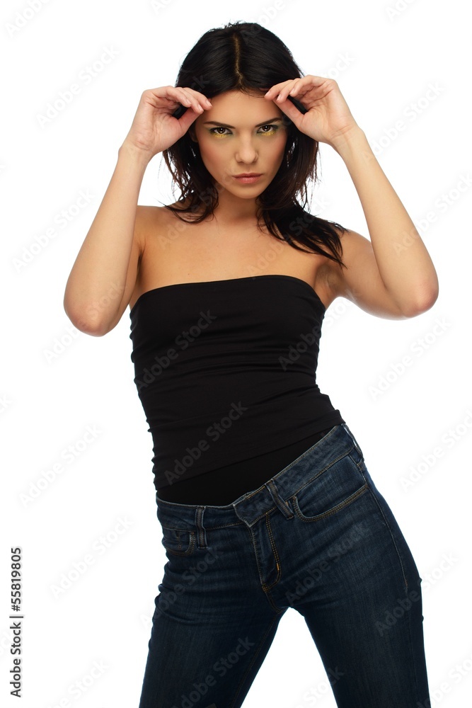 Young beautiful brunette woman in black top and jeans Young beautiful brunette woman in black top and jeans