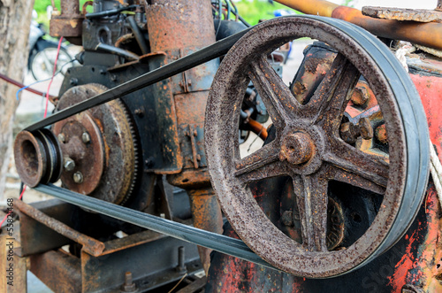 Old pulley and belt of the lawnmower