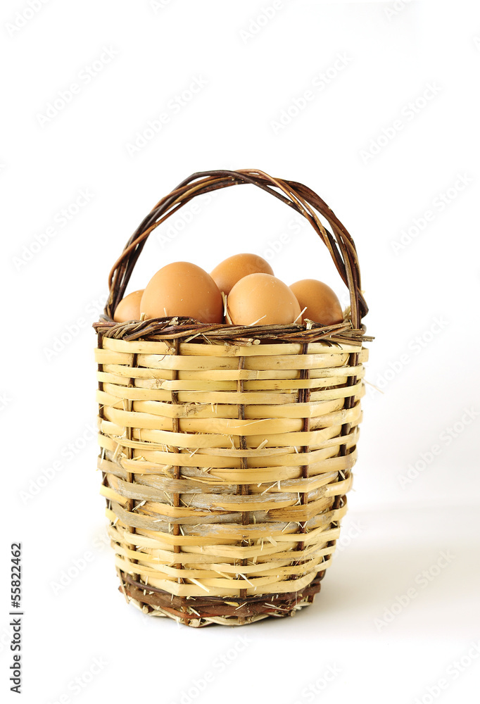 Fresh organic farm eggs on handbasket Fresh organic farm eggs on handbasket