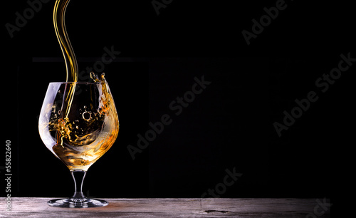 Cognac or brandy on a wooden table photo