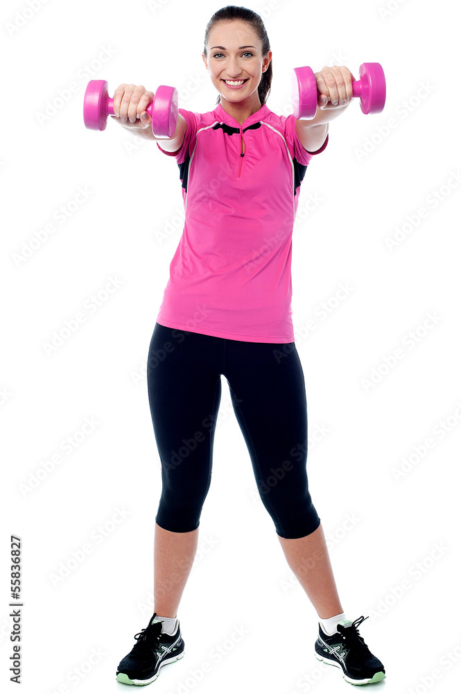 Happy gym woman lifting dumbbells Happy gym woman lifting dumbbells