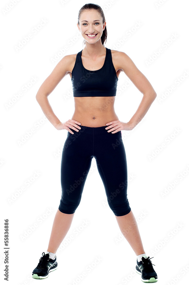 Slim athletic woman posing with a radiant smile Slim athletic woman posing with a radiant smile