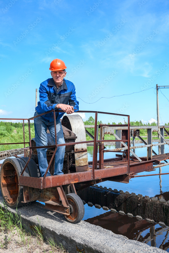 Senior engineering worker in water treatment plant Senior engineering worker in water treatment plant