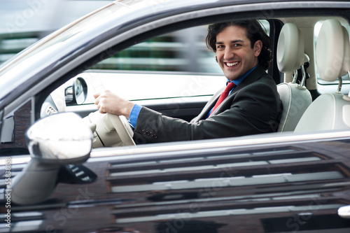 Corporate man driving his car © stockyimages