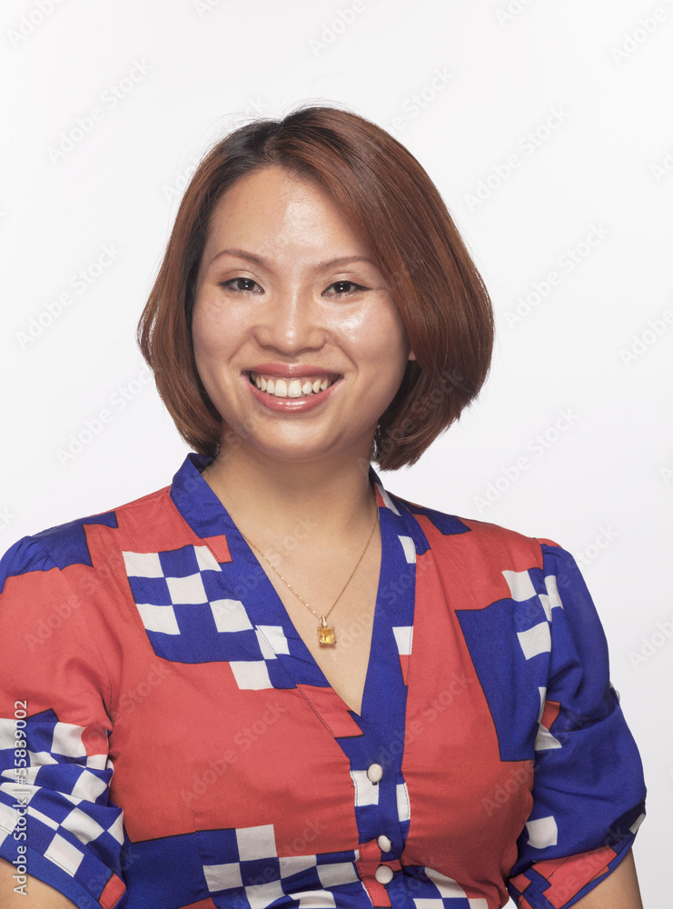 Portrait of smiling woman looking at camera, studio shot Portrait of smiling woman looking at camera, studio shot