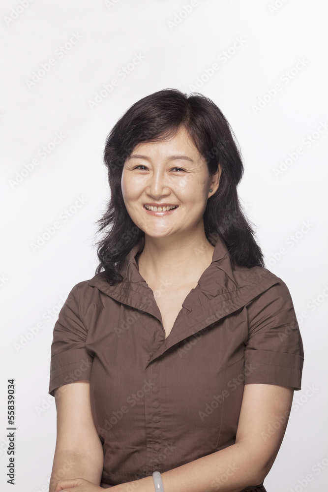 Portrait of smiling woman, studio shot Portrait of smiling woman, studio shot