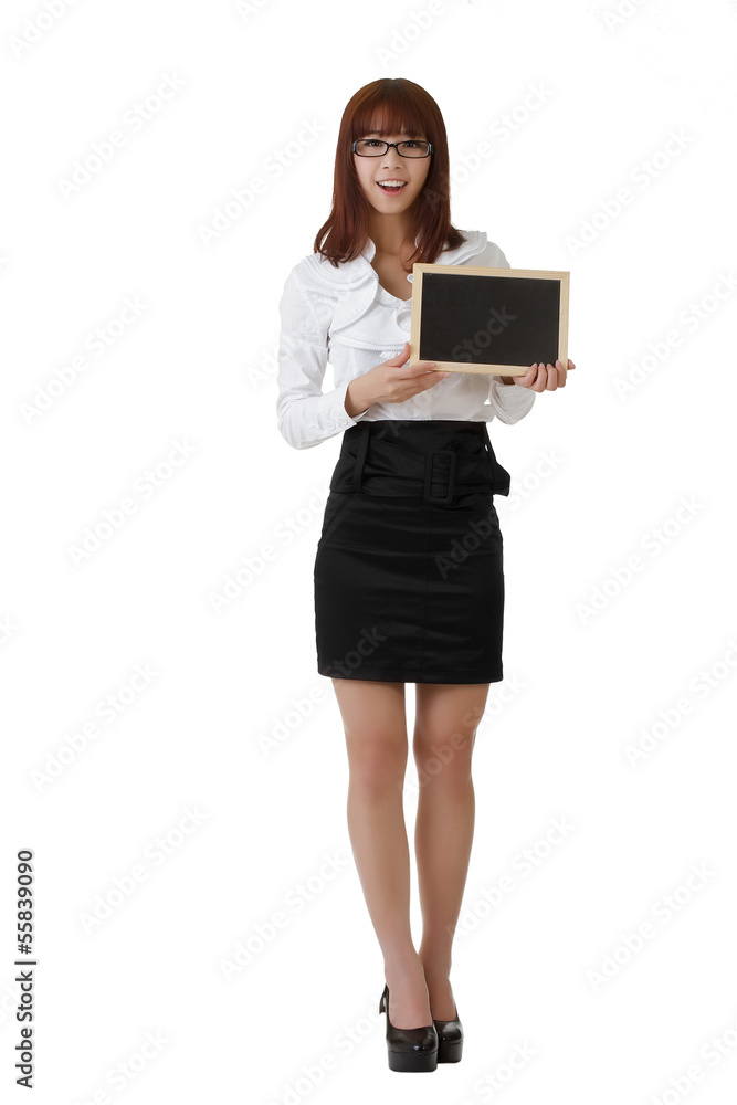 Smiling business woman holding blank blackboard Smiling business woman holding blank blackboard