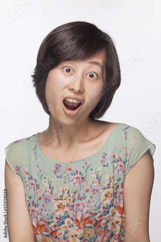 Portrait of surprised and shocked woman, studio shot