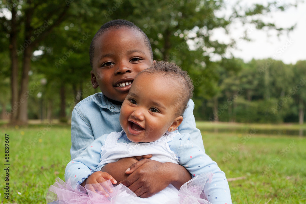 Fototapeta premium Smiling african boy and his sister