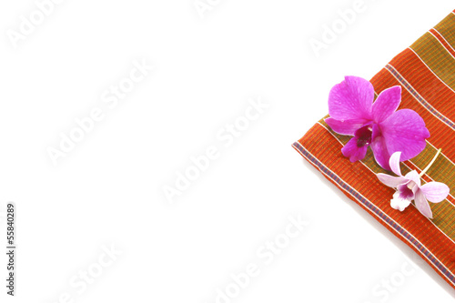 Thailand silk adorned with orchids on a white background photo