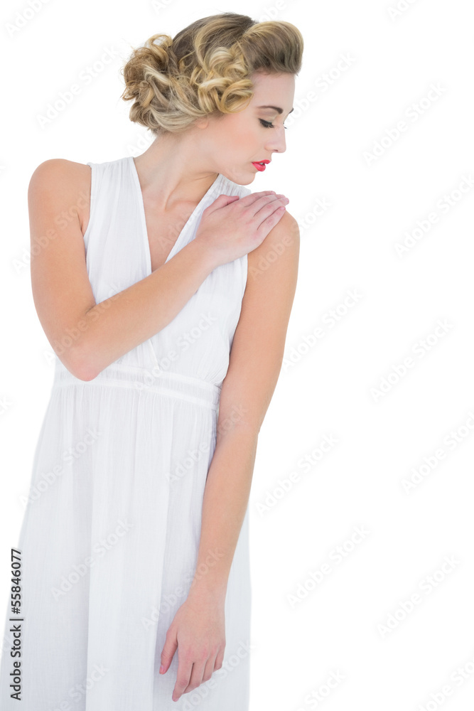 Peaceful fashion blonde model posing with closed eyes