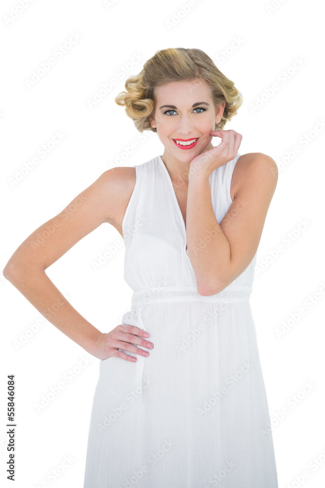 Cheerful fashion blonde model posing with a hand on the hip Cheerful fashion blonde model posing with a hand on the hip