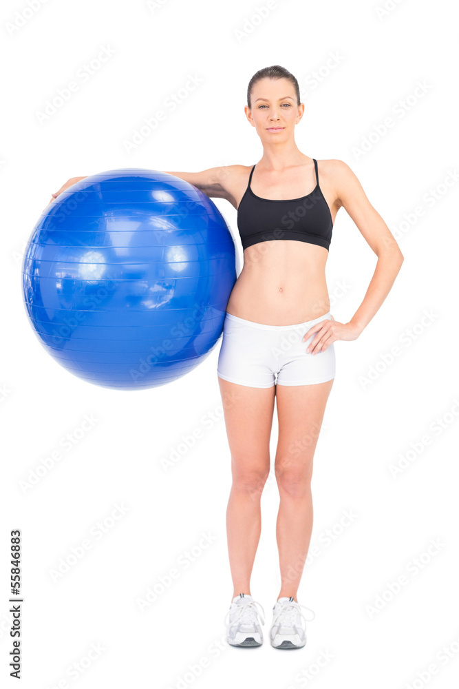 Relaxed fit woman holding exercise ball Relaxed fit woman holding exercise ball