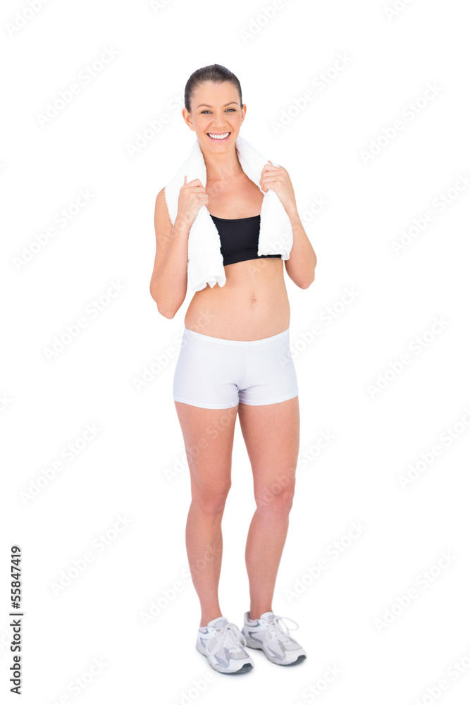 Smiling fit model in sportswear holding sport towel Smiling fit model in sportswear holding sport towel