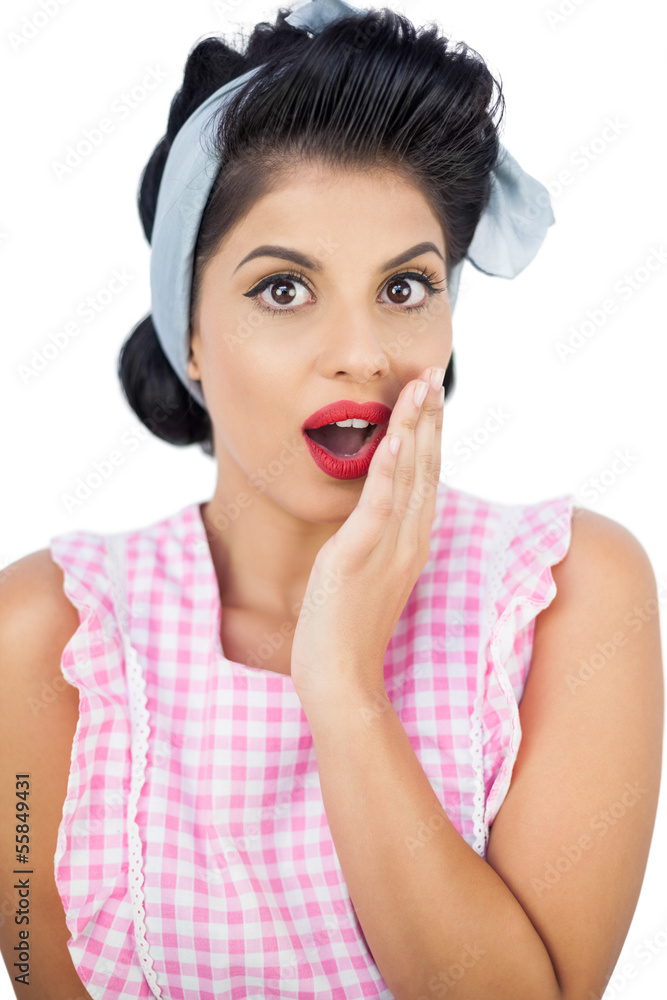 Surprised black hair model posing with a hand on the cheek Surprised black hair model posing with a hand on the cheek
