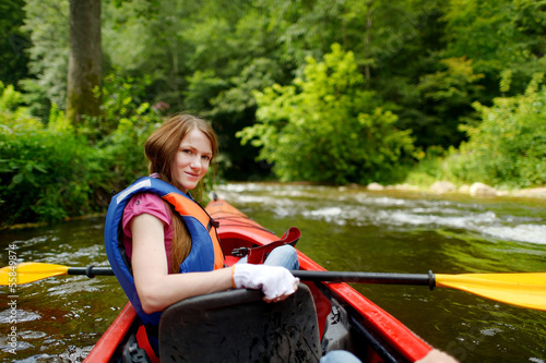 Young woman on a kayak