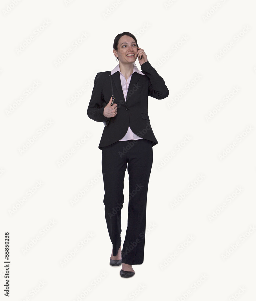Smiling young businesswoman on the phone, full length, studio shot Smiling young businesswoman on the phone, full length, studio shot