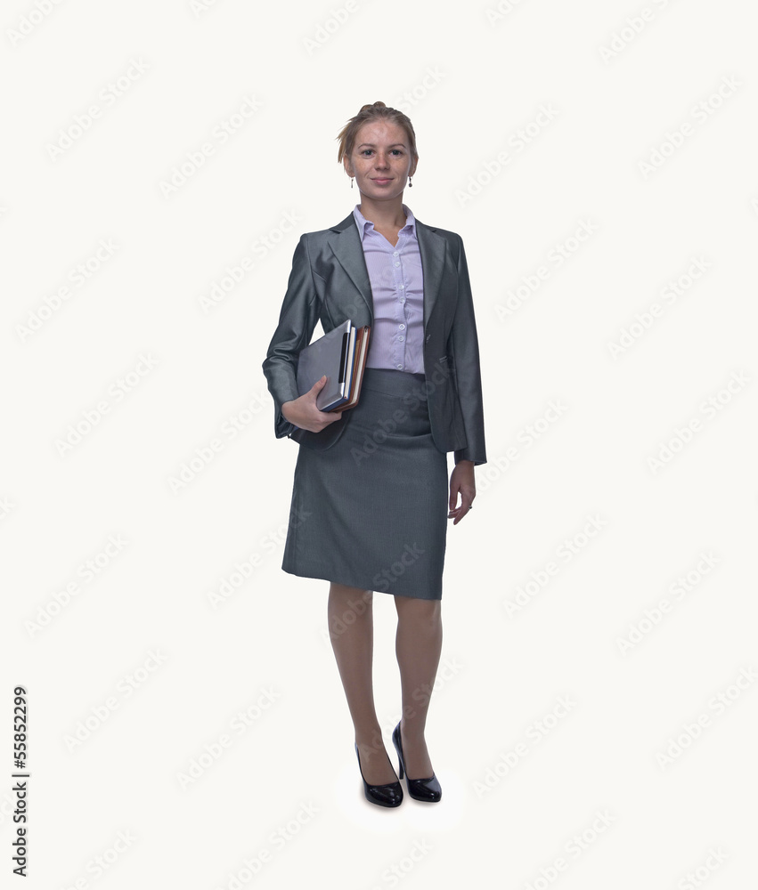 Portrait of smiling young businesswoman holding digital tablet and books, full length, studio shot Portrait of smiling young businesswoman holding digital tablet and books, full length, studio shot