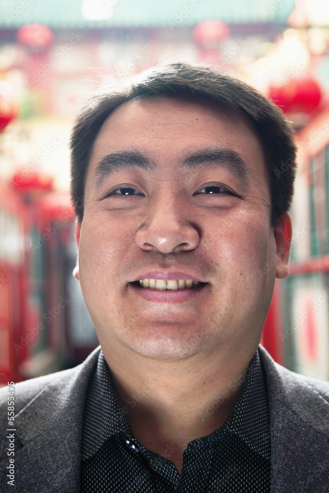 Portrait of mid adult man with Chinese lanterns in background Portrait of mid adult man with Chinese lanterns in background