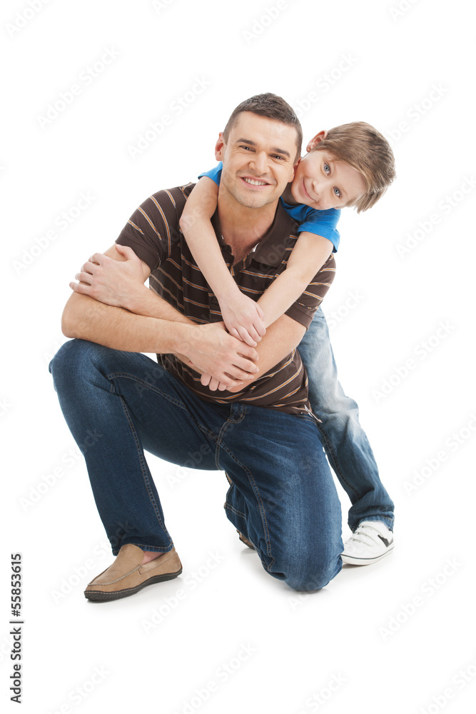 Father and son. Cheerful father and son standing close to each o Father and son. Cheerful father and son standing close to each o