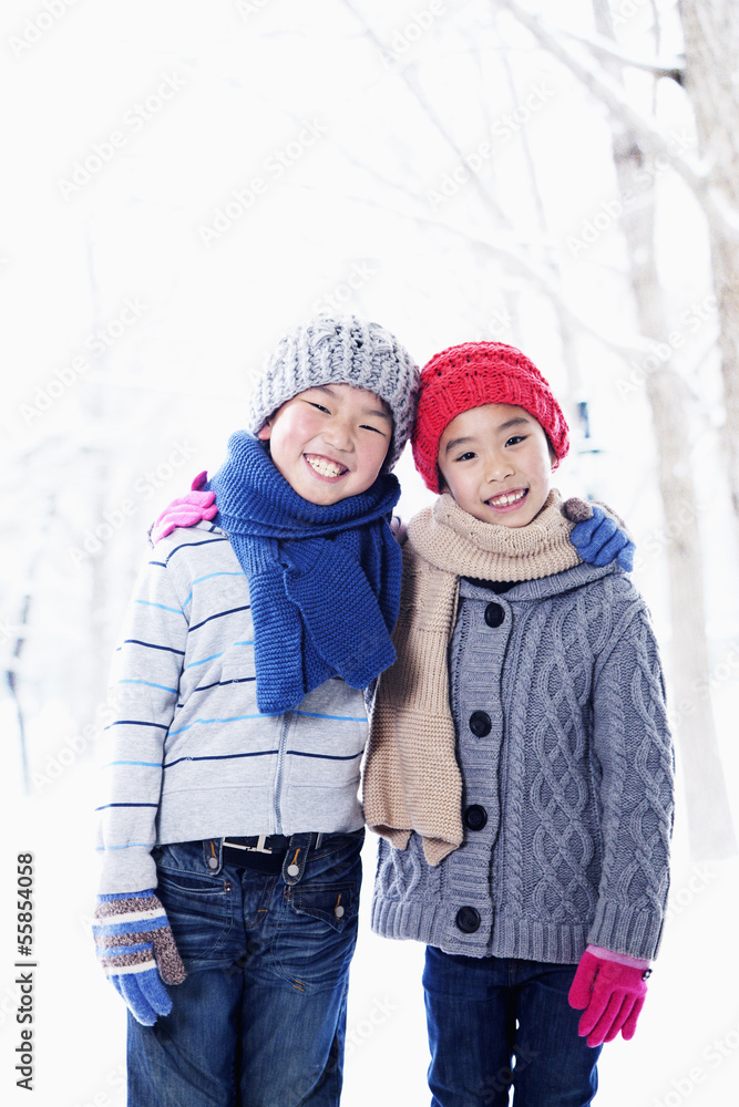 Fototapeta premium Boy and girl embracing, portrait