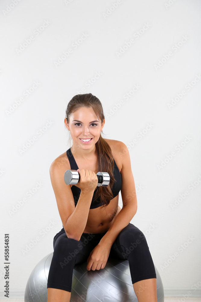 Beautiful young girl doing exercises at home Beautiful young girl doing exercises at home