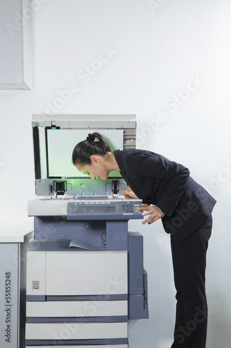 Businesswoman Photocopying Her Face