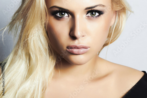 beautiful blond girl with green eyes.woman.professional make-up