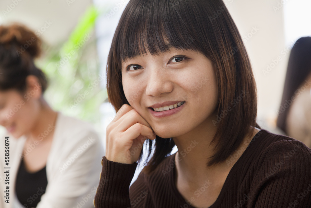 Businesswoman smiling in the office, portrait Businesswoman smiling in the office, portrait