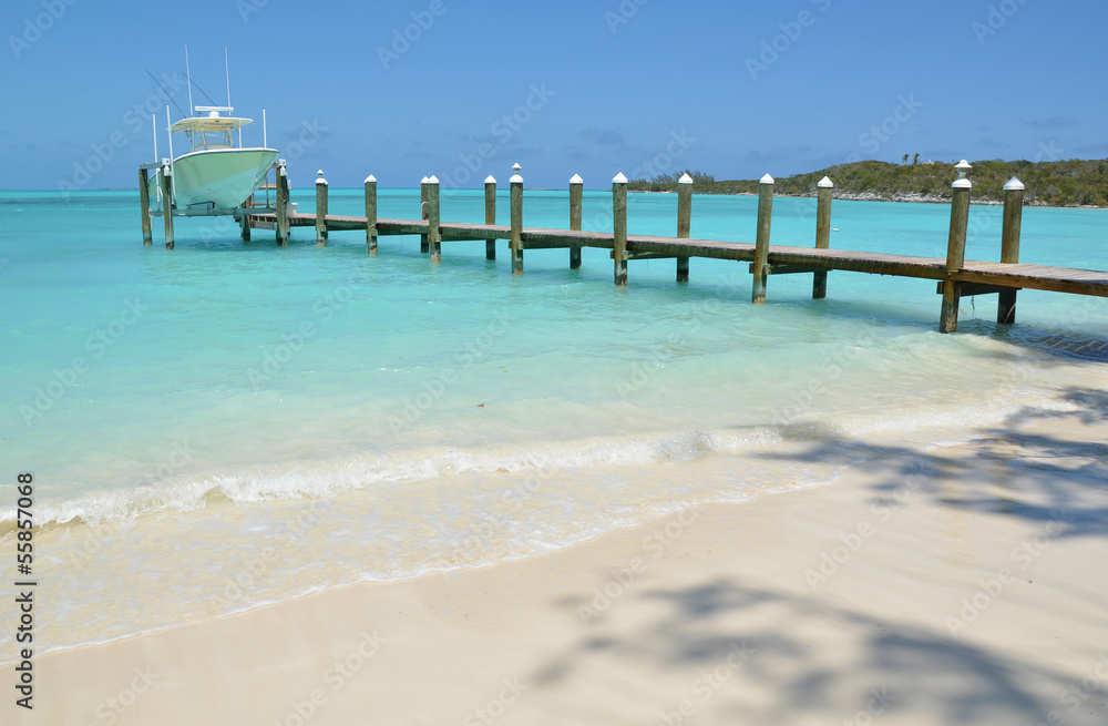 Yacht at the wooden jetty. Exuma, Bahamas