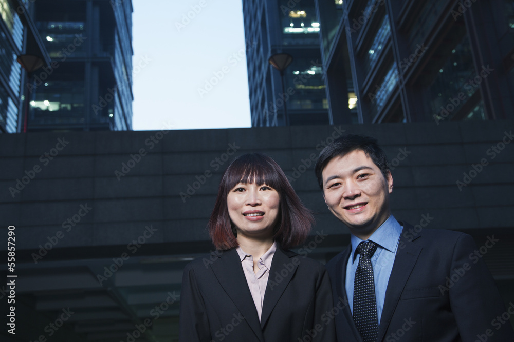 Portrait of two business people outdoors among skyscrapers in Beijing Portrait of two business people outdoors among skyscrapers in Beijing