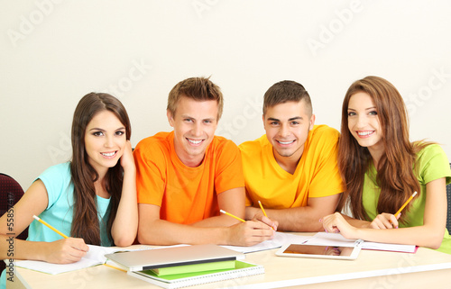 Group of young students sitting in the room