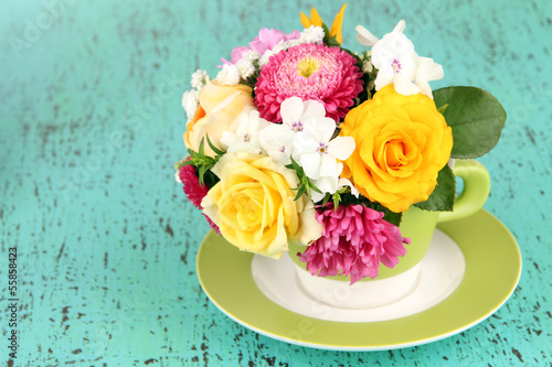 Fototapeta Naklejka Na Ścianę i Meble -  Beautiful bouquet of bright flowers in color vase,