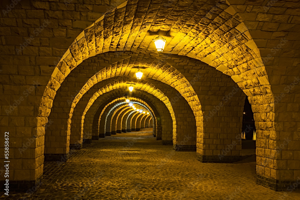 The arched stone colonnade with lanterns The arched stone colonnade with lanterns
